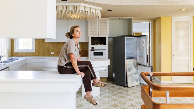 Ms Phillips in the retro kitchen. Picture: Aaron Francis.