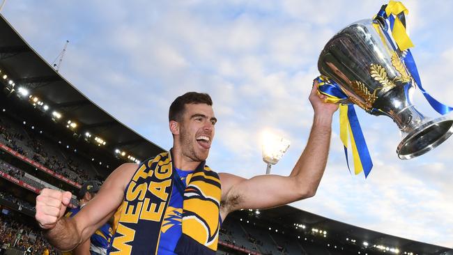 Eagles ruckman Scott Lycett holds the premiership trophy on Saturday. He will return to South Australia at the Power next season. Picture: AAP Image/Julian Smith