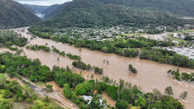 The Barron River in Cairns reached a record flood peak, with roads closed and homes flooded in the catchment area on Sunday, December 17. Image: Brendan Radke