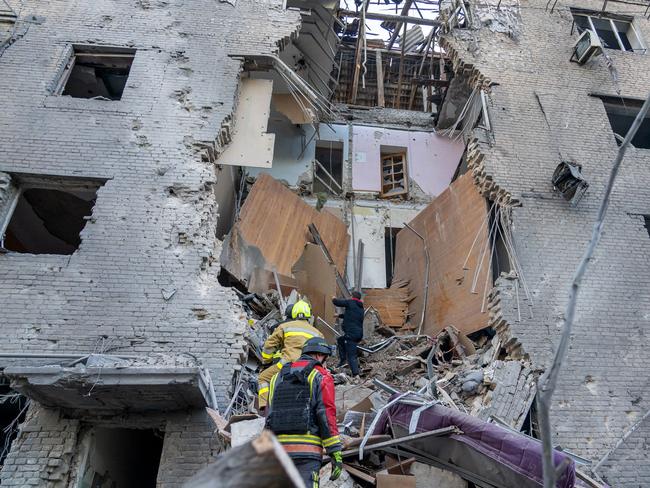 Ukrainian law enforcement officers working at the site of a missile attack in Zaporizhzhia, amid the Russian invasion of Ukraine. Picture: AFP