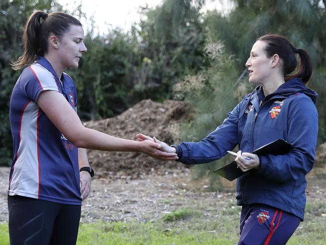 Scorpions captain Megan Schutt congratulates Tahlia McGrath after the 2km time trial. Picture: Sarah Reed