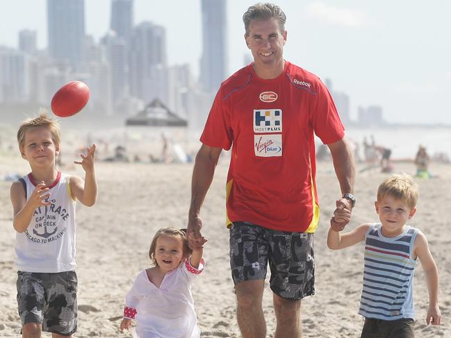 Levi Ashcroft (right) at age four, with father Marcus, sister Lucy and brother Will (left) on the Gold Coast in 2011. Picture: Tim Marsden