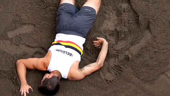TOKYO, JAPAN - AUGUST 04:  Thomas van der Plaetsen of Team Belgium is hurt while competing in the Men's Decathlon Long Jump on day twelve of the Tokyo 2020 Olympic Games at Olympic Stadium on August 04, 2021 in Tokyo, Japan. (Photo by Rob Carr/Getty Images)