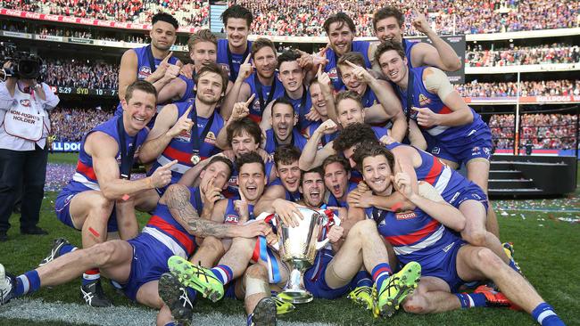 The 22 players who represented the Bulldogs on Grand Final day and won the club a premiership celebrate with a team photo. Picture: Michel Klein