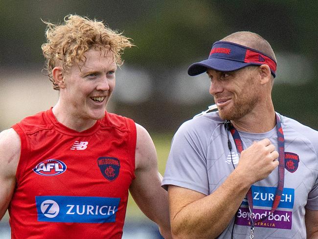MELBOURNE, FEBRUARY 9, 2022: Melbourne Football Club coach Simon Goodwin pictured with Clayton Oliver during MFC training at Casey Fields. Picture: Mark Stewart