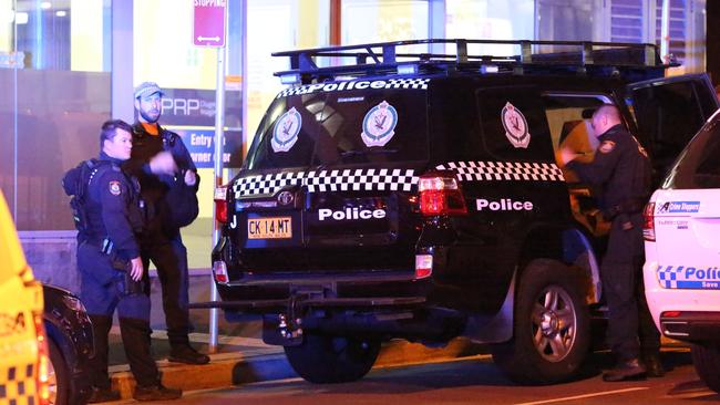 Police at the scene of the shooting. Picture: Steve Tyson