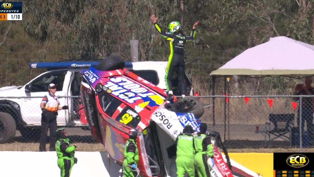 Mick Sieders waves to the crowd after his spectacular SuperUtes rollover.