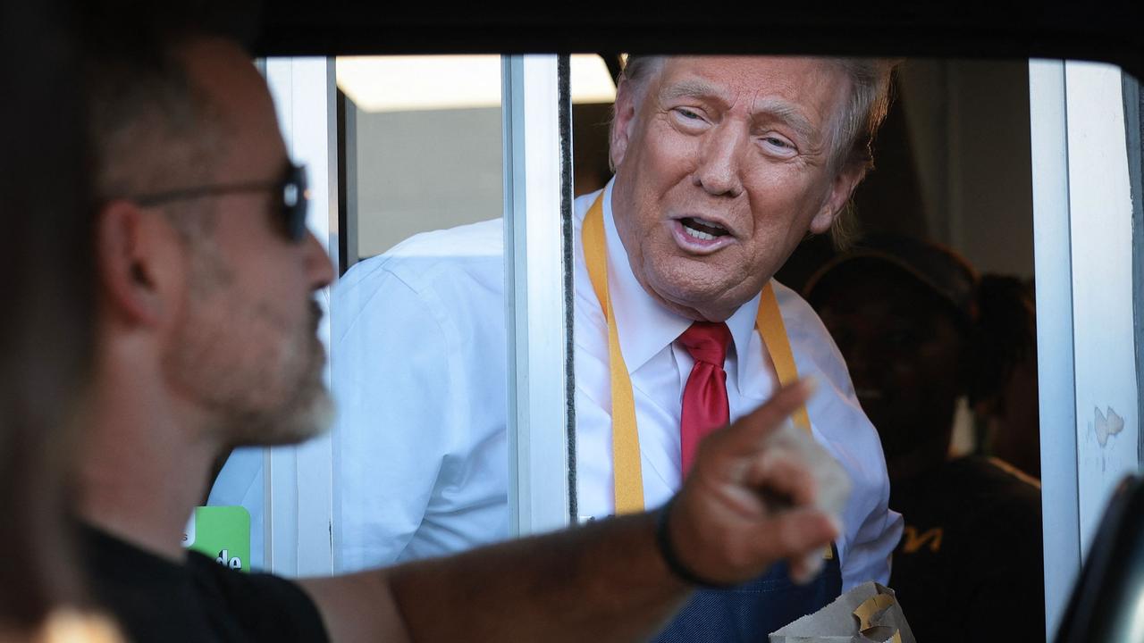 Would you like fries with that? Republican presidential nominee and former US President Donald Trump works the drive-through line as he visits a McDonald's restaurant on October 20 in Feasterville-Trevose, Pennsylvania. Picture: Win McNamee/Getty Images North America/Getty Images via AFP