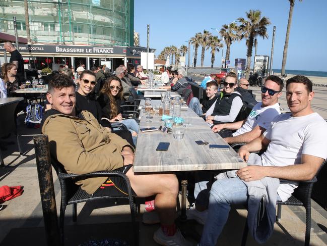 From left, Greg Bird, Becky Bird, Erin Pomeroy, Kade Maloney, Jess Maloney, James Maloney, and Ben Pomeroy have lunch by the beach near Perpignan, France. Picture: Ella Pellegrini