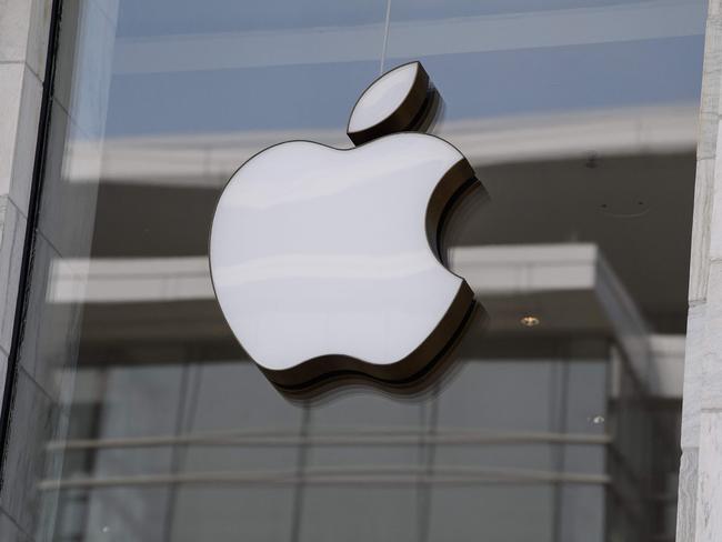 (FILES) In this file photo taken on September 14, 2021 The Apple logo is seen at the entrance of an Apple store in Washington, DC. - Apple reported better-than-expected profits Thursday on robust consumer demand for its devices and services even as revenue growth slowed while it navigated an ongoing semiconductor supply crunch. The technology giant reported quarterly earnings of $25 billion, up 5.8 percent from the year-ago period as revenues rose nine percent to $97.3 billion. (Photo by Nicholas Kamm / AFP)