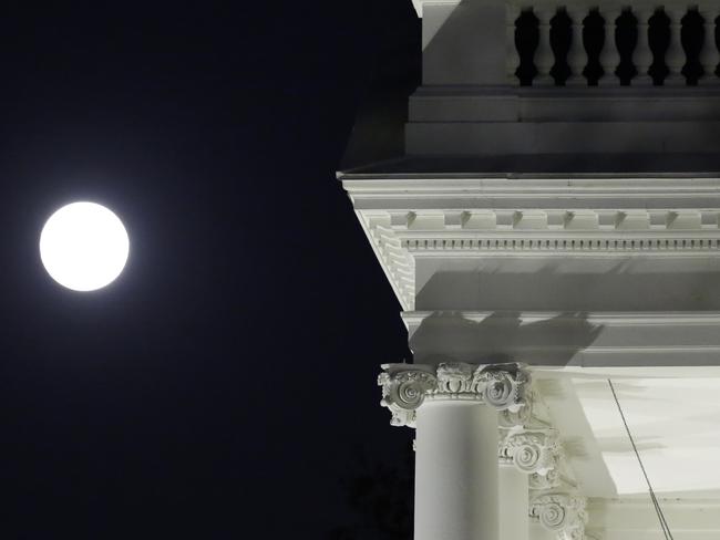 The moon rises over the White House in Washington on November 13, 2016. An unusually large and bright Moon will adorn the night sky on Monday, November 14, 2016 -- the closest “supermoon” to Earth in 68 years and a chance for dramatic photos and spectacular surf. Picture: AFP PHOTO / YURI GRIPAS