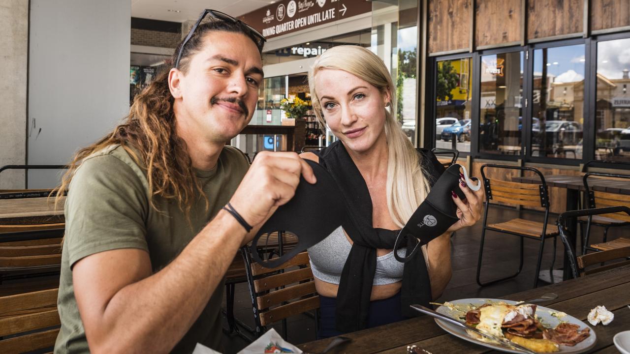 Kevin Wharton and Rebecca Aberdeen take their masks off to eat at Coffee Emporium as wearing of masks is compulsory in most indoor settings, Sunday, January 2, 2022. Picture: Kevin Farmer