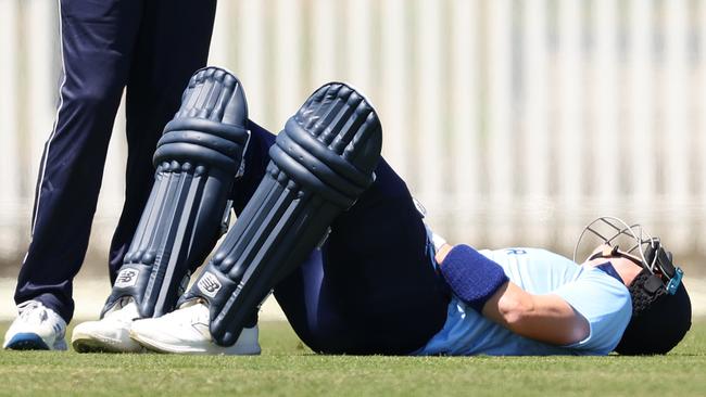 Steve Smith on the ground after he was struck by a delivery from Peter Siddle (Photo by Robert Cianflone/Getty Images)