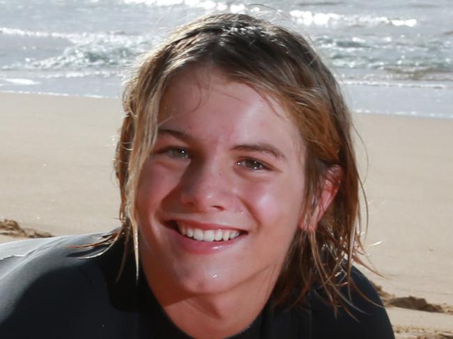 CENTRAL COAST EXPRESS ADVOCATE / AAP.Max Taylor poses for a photo with his surfboard on Wamberal Beach. Saturday 16th June 2019Max rescued a UK swimmer in March he was just 11-years-old at the time (now12)(AAP IMAGE / MARK SCOTT)