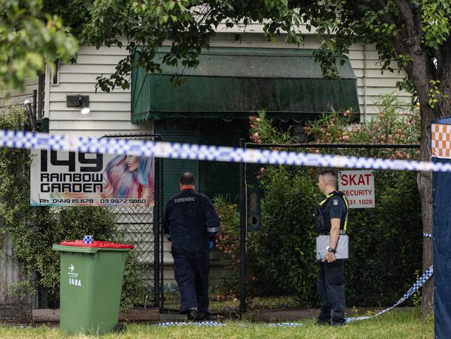 Police outside the brothel on Cowper St. Picture: Diego Fedele