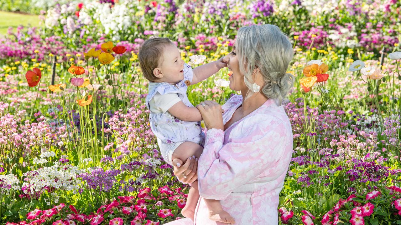 Sarah McVeigh and daughter Greta at the Botanic Gardens in Queens Park for the Toowoomba Carnival of Flowers. Photo: Nev Marsden