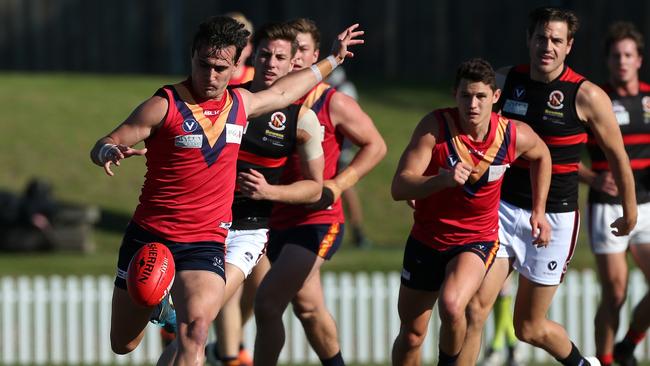 Nick Jamieson takes a kick for Old Scotch. Picture: Hamish Blair