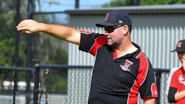 North's Baseball Club Coach Paul Simes giving instructions on the field in the friendly opener of the club's 75th season. Picture: Cath Piltz