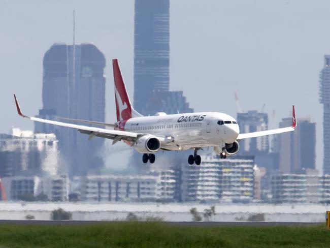 Qantas plane lands, New flight paths for Brisbane Airport, Monday 4th April 2022 - Photo Steve Pohlner