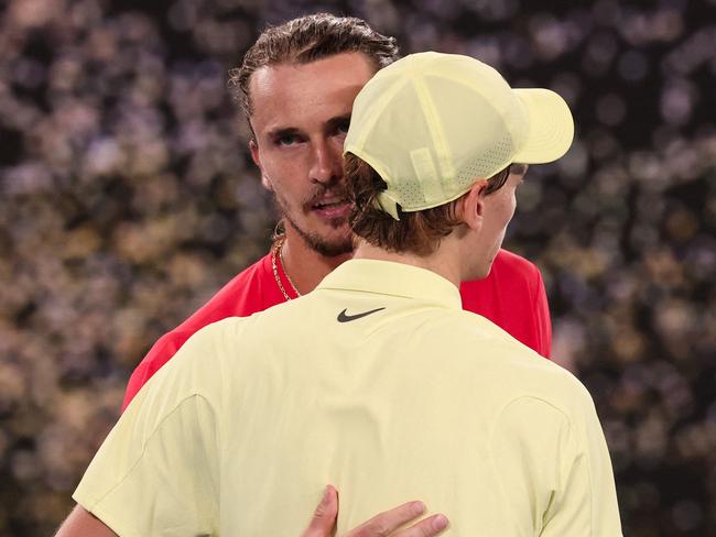 Italy's Jannik Sinner (R) speaks with Germany's Alexander Zverev after his victory during their men's singles final match on day fifteen of the Australian Open tennis tournament in Melbourne on January 26, 2025. (Photo by DAVID GRAY / AFP) / -- IMAGE RESTRICTED TO EDITORIAL USE - STRICTLY NO COMMERCIAL USE --