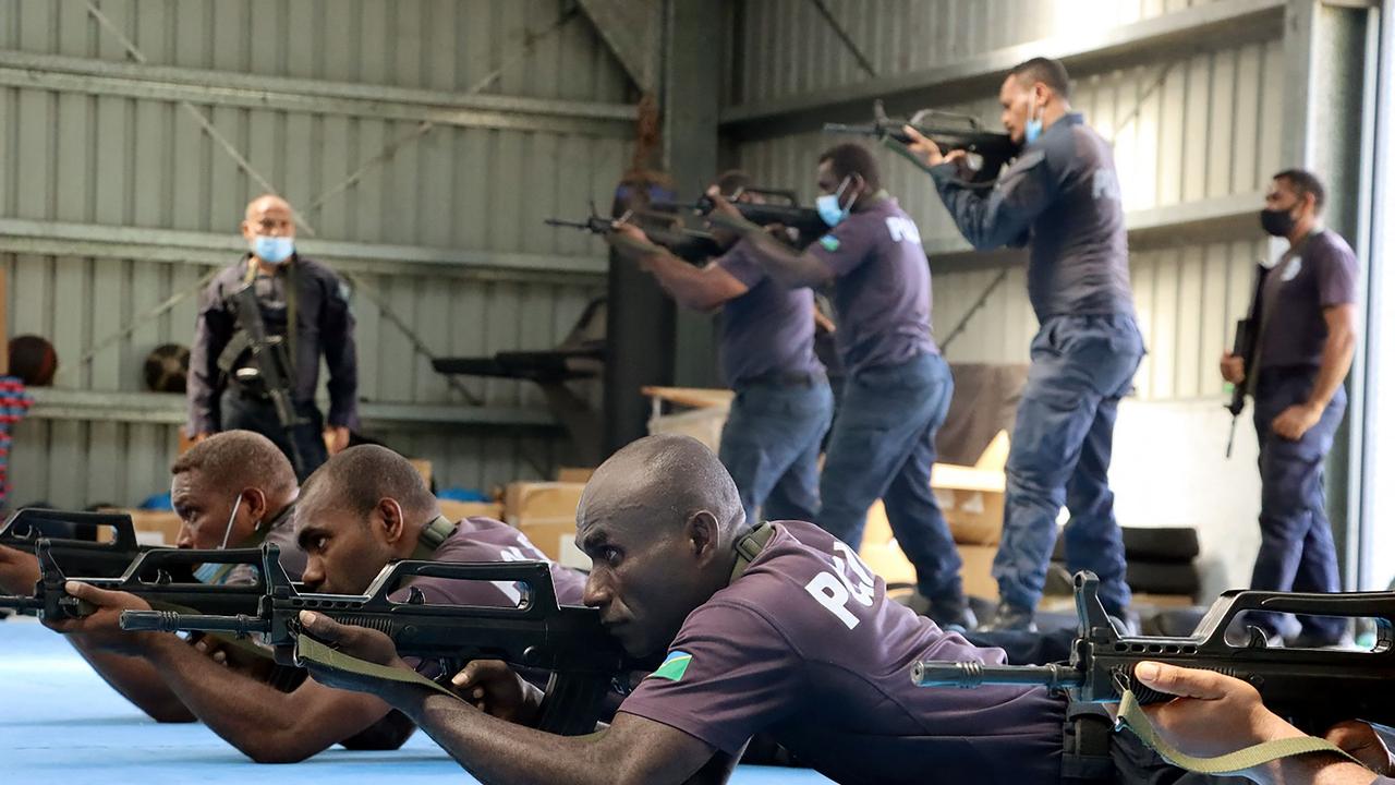 China Police Liason Team officers training local Solomon Islands police officers: Photo by Handout / RSIPF / AFP