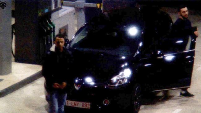 Abdeslam, left, and Abrini on November 11 fill up a Renault Clio used in the Paris attacks at Ressons.