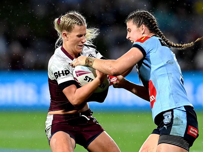 SUNSHINE COAST, AUSTRALIA - JUNE 25: Shenae Ciesiolka of Queensland attempts to break away from the defence of Jessica Sergis of New South Wales during the Women's Rugby League State of Origin match at the Sunshine Coast Stadium on June 25, 2021 in Sunshine Coast, Australia. (Photo by Bradley Kanaris/Getty Images)