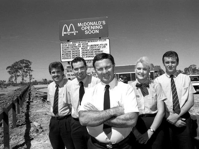 Ron Reseck (centre) and staff members (from left) Dean Bennett, Brent Gilmore, Angela Grieve and Trevor Rogers outside Mackay's first McDonald's Restaurant ahead of its opening in 1990. Picture: Daily Mercury Archives