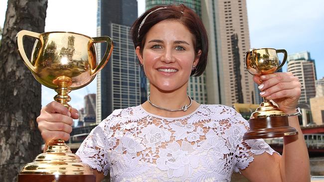 Payne poses with her prize. Picture: Getty