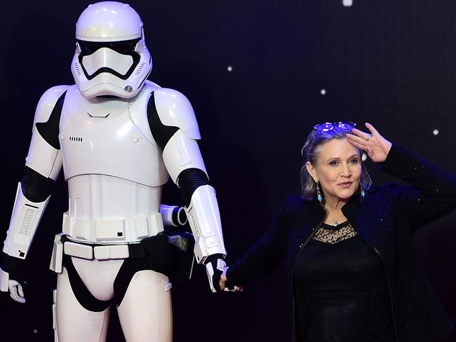 Carrie Fisher posing with a storm trooper at the European Premiere of <i>Star Wars: The Force Awakens. </i>Picture: AFP