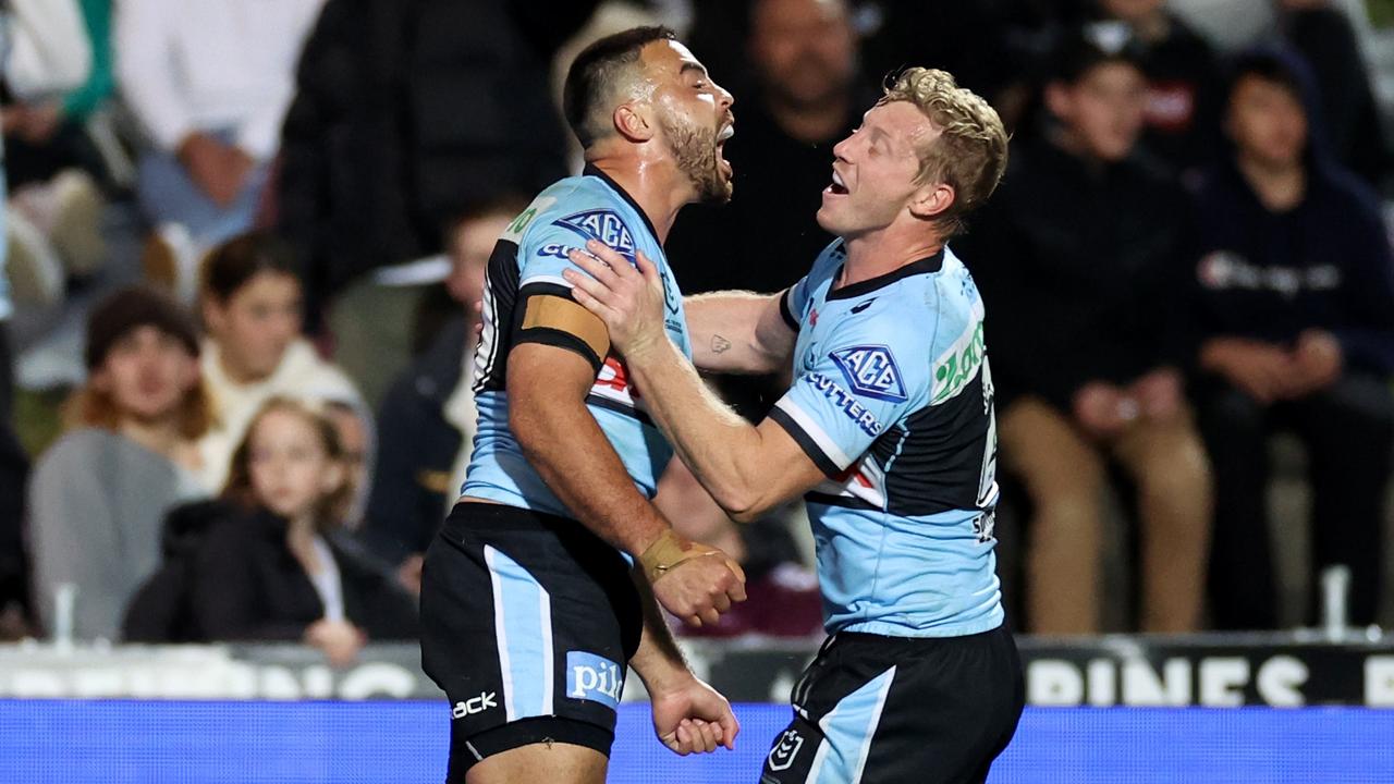 SYDNEY, AUSTRALIA - AUGUST 20: Matt Ikuvalu of the Sharks celebrates after scoring a try during the round 23 NRL match between the Manly Sea Eagles and the Cronulla Sharks at 4 Pines Park, on August 20, 2022, in Sydney, Australia. (Photo by Cameron Spencer/Getty Images)