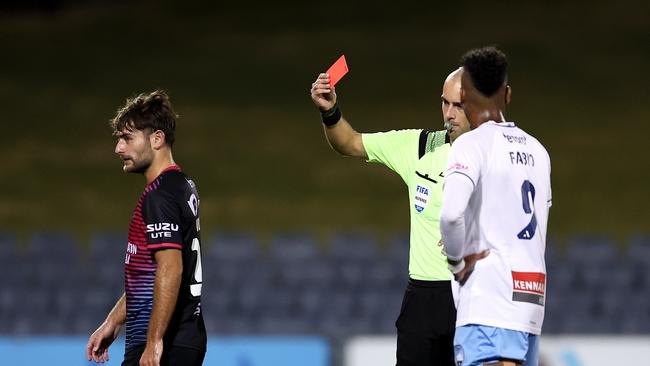 Referee Daniel Elder shows Macarthur FC defender Ivan Vujica (left) a red card at Campbelltown Sports Stadium on Saturday night. Picture: Brendon Thorne/Getty Images