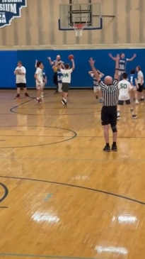 Heartwarming moment basketball team helps boy with Down syndrome