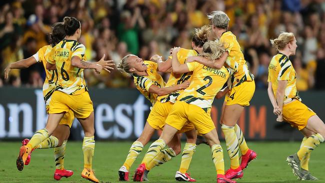 Emily van Egmond is mobbed by her teammates after scoring the equaliser against China at Bankwest Stadium on Thursday night Picture: Getty Images
