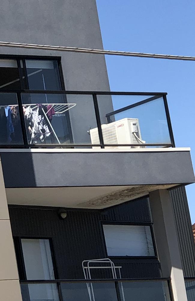 With major defects in the building (like the massive mould spot under the balcony pictured), residents are wondering how the VBA allowed homeowners to buy the property. Picture: Copyright/news.com.au