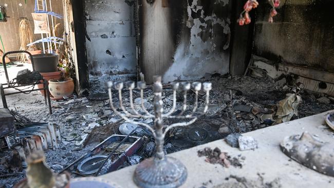 A Hanukkah menorah is left on a counter of a destroyed house after Hamas attacked a kibbutz at Kissufim, near the border of Gaza.