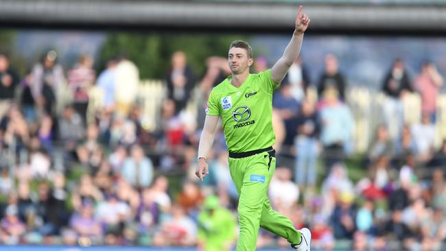 Daniel Sams of the Thunder celebrates another wicket