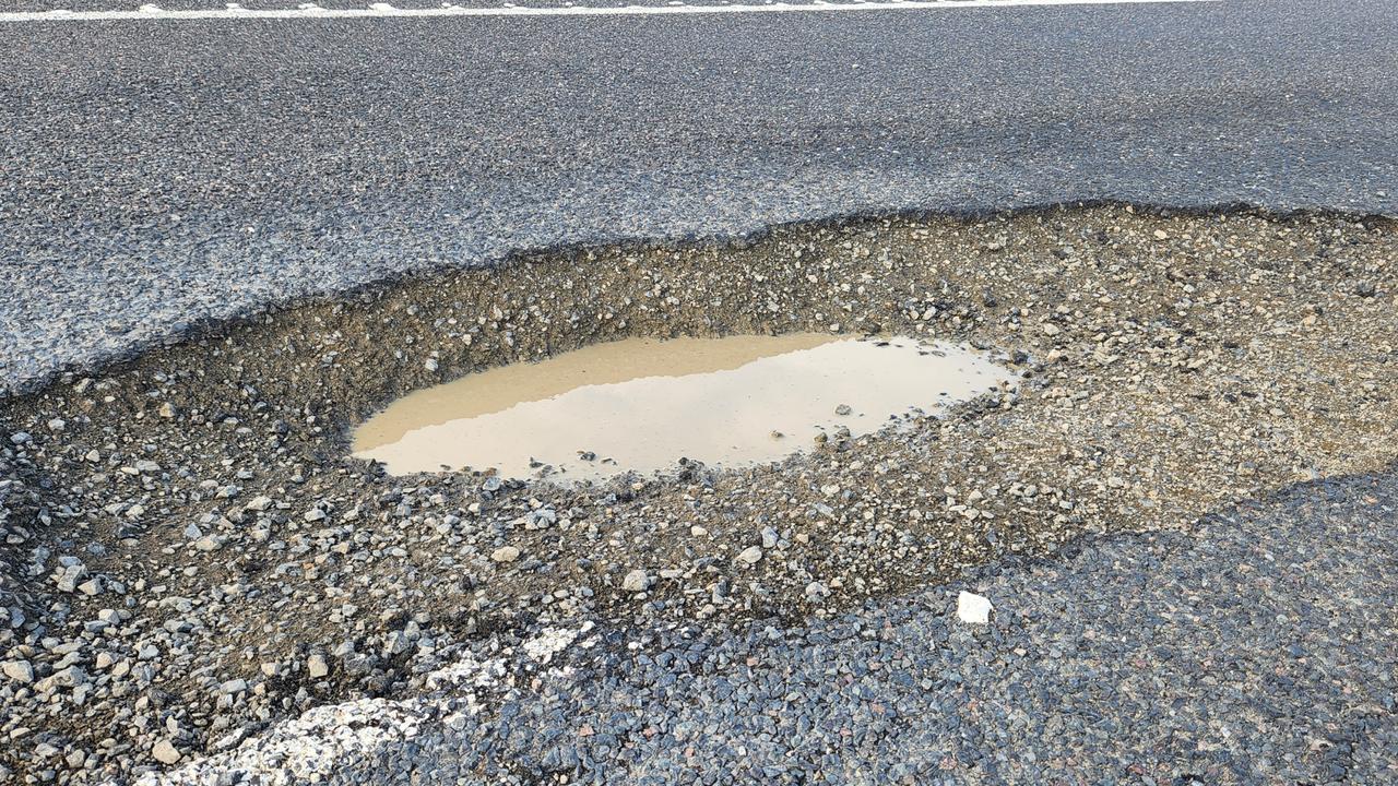 The potholes on the Bruce Highway near Bajool in Central Queensland on August 14. Photos Darryn Nufer.