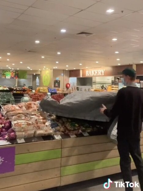 He said they open up the fridges, check for any leaks and then take off the potato tarps. Picture: TikTok/woolworths_au