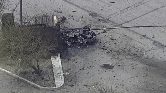 Debris covers the ground and around a vehicle after an explosion on Saturday, May 17, 2025 in Palm Springs, Calif. (ABC7 Los Angeles via AP)