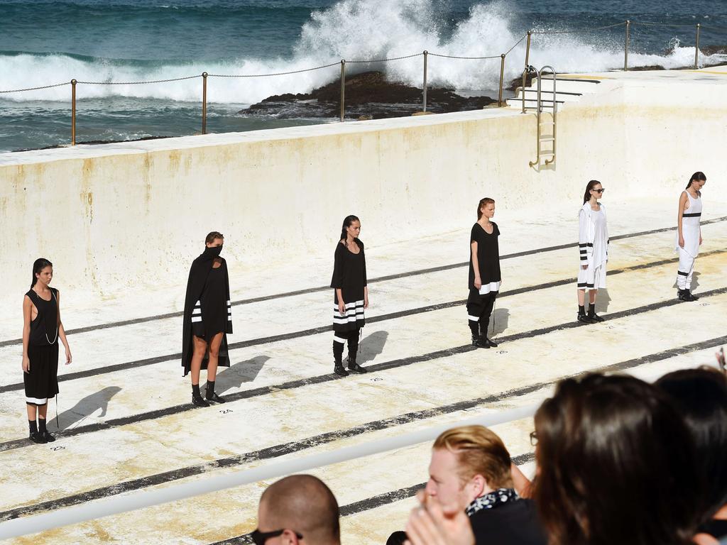 Models showcase designs during the Ten Pieces show at Mercedes-Benz Fashion Week Australia 2015 at Bondi Icebergs. Picture: AFP