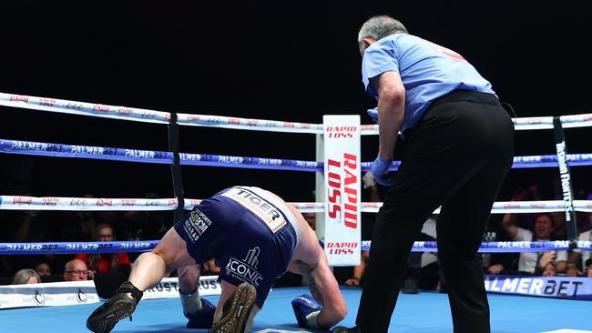 SYDNEY, AUSTRALIA - JUNE 16: Justis Huni knocks Paul Gallen to the canvas during their Australian heavyweight title fight at ICC Sydney on June 16, 2021 in Sydney, Australia. (Photo by Cameron Spencer/Getty Images)