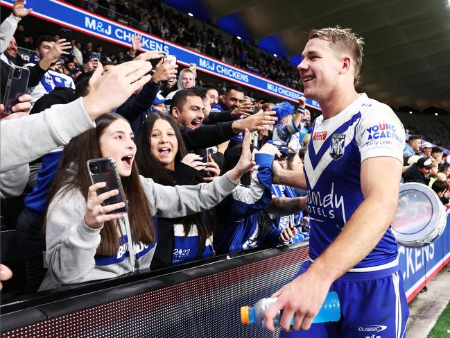 SYDNEY, AUSTRALIA - JUNE 19:  Matt Burton of the Bulldogs celebrates victory with fans after the round 15 NRL match between the Canterbury Bulldogs and the Wests Tigers at CommBank Stadium, on June 19, 2022, in Sydney, Australia. (Photo by Matt King/Getty Images)