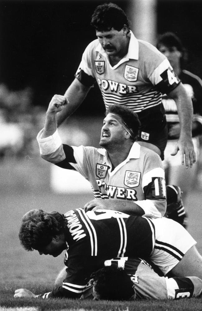 Greg Dowling celebrates Broncos first try by Brett Le Man against Manly at Lang Park.