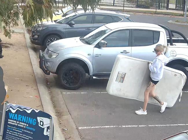 A woman is captured dumping a mattress on the side of the road at Manor Lakes Picture: Supplied