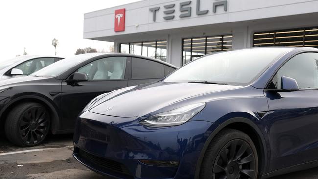 CORTE MADERA, CALIFORNIA - DECEMBER 20: New Tesla cars are displayed at a Tesla dealership on December 20, 2024 in Corte Madera, California. Electric car maker Tesla is recalling 700,000 vehicles over a tire pressure warning system that could fail to warn drivers of low tire pressure. 2024 Cybertrucks, 2017-2025 Model 3 and 2020-2025 Model Y are being recalled.   Justin Sullivan/Getty Images/AFP (Photo by JUSTIN SULLIVAN / GETTY IMAGES NORTH AMERICA / Getty Images via AFP)