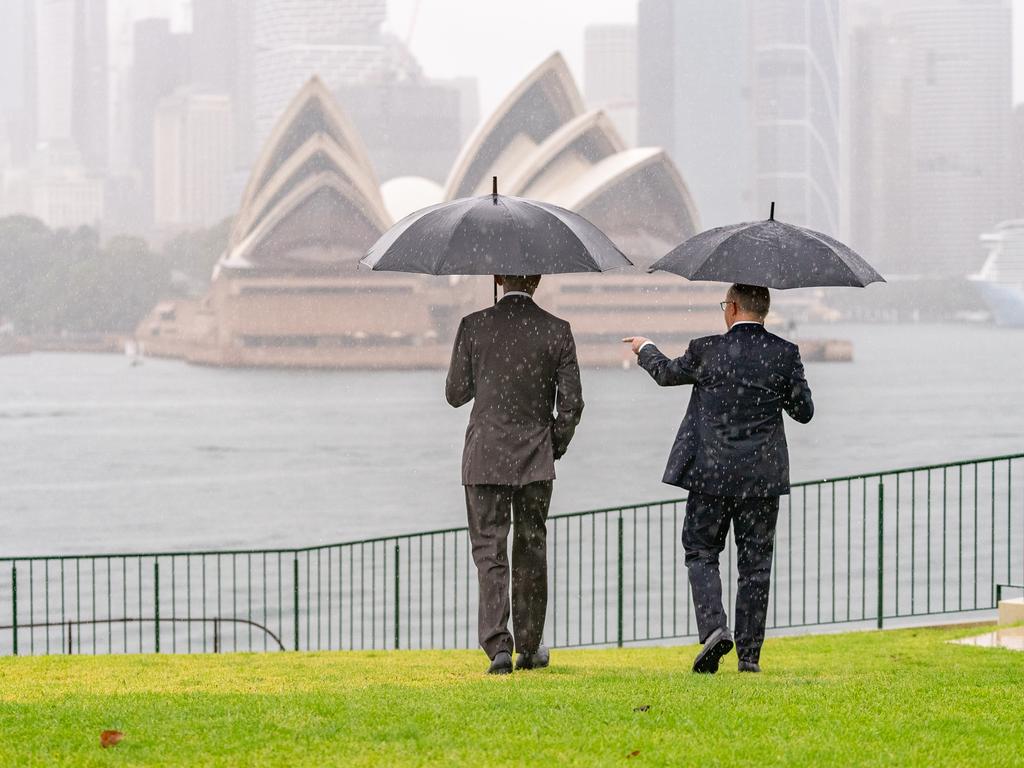 The two leaders posed for photos in the rain. Picture: Supplied via Prime Minister's Office