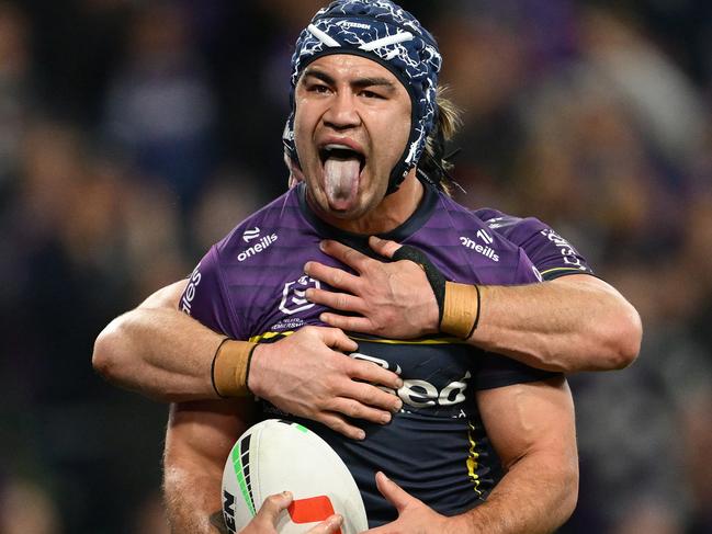 MELBOURNE, AUSTRALIA - SEPTEMBER 27: Jahrome Hughes of the Storm celebrates scoring a try during the NRL Preliminary Final match between the Melbourne Storm and Sydney Roosters at AAMI Park on September 27, 2024 in Melbourne, Australia. (Photo by Quinn Rooney/Getty Images)