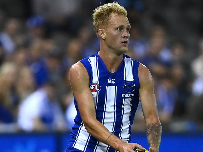 MELBOURNE, AUSTRALIA - MARCH 21: Jaidyn Stephenson of the Kangaroos kicks during the round one AFL match between the North Melbourne Kangaroos and the Port Adelaide Power at Marvel Stadium on March 21, 2021 in Melbourne, Australia. (Photo by Quinn Rooney/Getty Images)