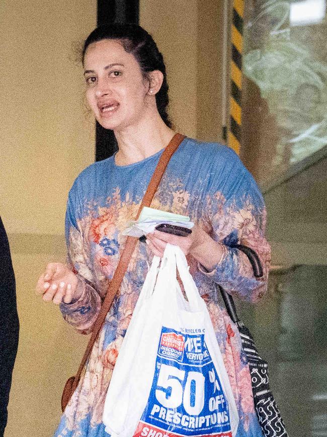 Chantelle Elizabeth Carrington, who allegedly stole over fifty thousand dollars worth of luxury designer items from a shop at Sydney International Airport, walks out of court at Downing Centr. Picture: Tom Parrish